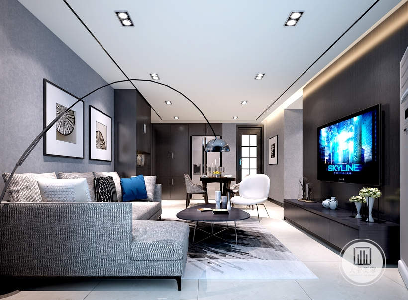客厅以灰白色两色为主色调搭配黑色的家具，使得节奏过快的上班族回到家带来精神和视觉上的放松。